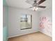 bedroom with carpet, ceiling fan, and large window with blinds at 1317 S Pine Ridge Cir # 1317, Sanford, FL 32773