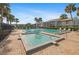 Pool features lounge seating and lush palm trees at 1317 S Pine Ridge Cir # 1317, Sanford, FL 32773