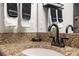 Bathroom sink features granite countertops and black fixtures at 1412 Moon Valley Dr, Davenport, FL 33896