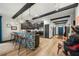 Wide shot of a kitchen featuring dark wood beams and a mosaic-backed island at 1412 Moon Valley Dr, Davenport, FL 33896