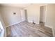 Bedroom featuring durable wood-look flooring, neutral paint, and a closet at 1442 S Hawthorne Ave, Apopka, FL 32703