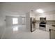 Open concept view of kitchen area, tile flooring, ceiling fan, and bright lighting at 1442 S Hawthorne Ave, Apopka, FL 32703