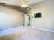 Bright bedroom featuring neutral walls, vaulted ceiling, plush carpeting, and a ceiling fan at 1525 Oakwood Ct, Apopka, FL 32703