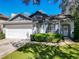 Charming single-story home featuring an attached two-car garage and well-maintained landscaping at 1525 Oakwood Ct, Apopka, FL 32703