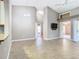 Open floor plan with tile flooring, high ceilings, and views to other rooms at 1525 Oakwood Ct, Apopka, FL 32703