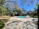 Inviting pool area with ample patio space for relaxation and outdoor enjoyment on a sunny day at 1525 Oakwood Ct, Apopka, FL 32703