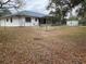 Spacious backyard featuring patio, fencing, and a storage shed at 15683 Sw 46Th Cir, Ocala, FL 34473