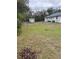 Spacious backyard with a storage shed and chain-link fence, offering both utility and security at 15683 Sw 46Th Cir, Ocala, FL 34473