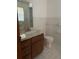 Bathroom with tile flooring, tile walls, and a sink with lots of counter space at 15683 Sw 46Th Cir, Ocala, FL 34473