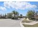 The community entrance welcomes residents with manicured landscaping, a gate, and distinguished signage at 1601 Pink Dogwood Way, Oviedo, FL 32765