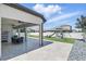 Covered patio with outdoor seating, fan and a view of the backyard play area at 1601 Pink Dogwood Way, Oviedo, FL 32765