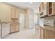 Kitchen with white tile floors and white appliances at 1601 Stoneywood Way, Apopka, FL 32712