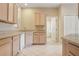 Bright kitchen featuring white appliances and views of the dining room at 1601 Stoneywood Way, Apopka, FL 32712