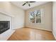 Living room features a fireplace and a large window, enhancing the natural light and ambiance at 1601 Stoneywood Way, Apopka, FL 32712