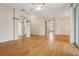 Bright living room featuring hardwood floors, archways, and ceiling fan at 1601 Stoneywood Way, Apopka, FL 32712