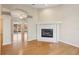 Bright living room featuring a fireplace and beautiful flooring, with access to the backyard at 1601 Stoneywood Way, Apopka, FL 32712
