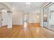 Bright and airy living room showcasing gleaming hardwood floors and an open floor plan at 1601 Stoneywood Way, Apopka, FL 32712