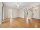 Spacious living room featuring hardwood floors, elegant archways, and neutral paint, creating a calming atmosphere at 1601 Stoneywood Way, Apopka, FL 32712