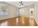 Large main bedroom featuring two windows, ceiling fan, and ensuite bathroom at 1601 Stoneywood Way, Apopka, FL 32712