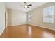 Large main bedroom with two windows, ceiling fan, and hardwood floors at 1601 Stoneywood Way, Apopka, FL 32712