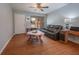 Cozy living room featuring hardwood floors, natural light, and comfortable seating at 1700 Edmundshire Rd, Orlando, FL 32812