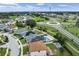 An aerial view of neighborhood homes that feature pools, solar panels, and well maintained landscaping at 1740 Standing Rock Cir, Oakland, FL 34787