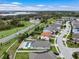 An aerial view of neighborhood homes that feature pools, solar panels, and well maintained landscaping at 1740 Standing Rock Cir, Oakland, FL 34787