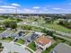 An aerial view of neighborhood homes that feature solar panels and well maintained landscaping at 1740 Standing Rock Cir, Oakland, FL 34787