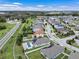 An aerial view of neighborhood homes that feature pools, solar panels, and well maintained landscaping at 1740 Standing Rock Cir, Oakland, FL 34787