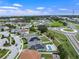 An aerial view of neighborhood homes that feature pools, solar panels, and well maintained landscaping at 1740 Standing Rock Cir, Oakland, FL 34787