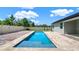 Backyard pool featuring brick pavers, clear blue water, and lush landscaping for a serene outdoor experience at 1740 Standing Rock Cir, Oakland, FL 34787