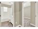 Bathroom and bedroom view featuring neutral wall paint and wood flooring at 1740 Standing Rock Cir, Oakland, FL 34787