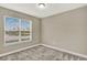 Cozy bedroom featuring neutral paint, carpet floors, and a window with blinds at 1740 Standing Rock Cir, Oakland, FL 34787