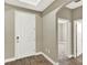 Entryway features tile flooring, a white front door, and arched doorways into the home at 1740 Standing Rock Cir, Oakland, FL 34787