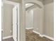 Hallway with arched doorway and wood flooring at 1740 Standing Rock Cir, Oakland, FL 34787