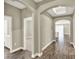 Hallway view includes a glimpse of the bathroom, bedroom, and dining area with tiled floors at 1740 Standing Rock Cir, Oakland, FL 34787