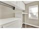 Laundry room featuring white cabinets and shelving at 1740 Standing Rock Cir, Oakland, FL 34787