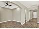 Living room with tile floors, ceiling fan, arches and neutral walls at 1740 Standing Rock Cir, Oakland, FL 34787