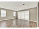 Spacious living room with wood floors and neutral walls at 1740 Standing Rock Cir, Oakland, FL 34787