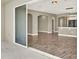 Open-concept living room featuring modern tile flooring and view of patio at 1740 Standing Rock Cir, Oakland, FL 34787