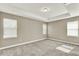 Main bedroom view with tray ceiling, windows and neutral wall color at 1740 Standing Rock Cir, Oakland, FL 34787