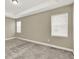 Open main bedroom with carpet flooring, ceiling lights and windows at 1740 Standing Rock Cir, Oakland, FL 34787