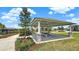 Picnic shelter with stone pillars, offering a shaded spot surrounded by lush landscaping and a walkway at 1740 Standing Rock Cir, Oakland, FL 34787