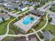 Aerial view of a community pool with cabana and lounge seating at 1740 Standing Rock Cir, Oakland, FL 34787