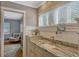 Bathroom featuring marble counters and sink with view to bedroom at 1800 Wycliff Dr, Orlando, FL 32803