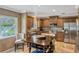 Traditional kitchen featuring wooden cabinetry, stainless steel appliances, and a center island at 1800 Wycliff Dr, Orlando, FL 32803