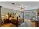 Main bedroom with wood floors, a ceiling fan, and French doors providing access to the outdoors at 1800 Wycliff Dr, Orlando, FL 32803