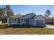 Charming single-story home with a well-manicured lawn and attached two-car garage at 1857 Manitoba Ct, Poinciana, FL 34759