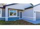 Charming single-story home featuring light gray stucco and a side entrance at 1857 Manitoba Ct, Poinciana, FL 34759