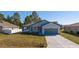 Charming single-story home with a well-manicured lawn and attached two-car garage at 1857 Manitoba Ct, Poinciana, FL 34759
